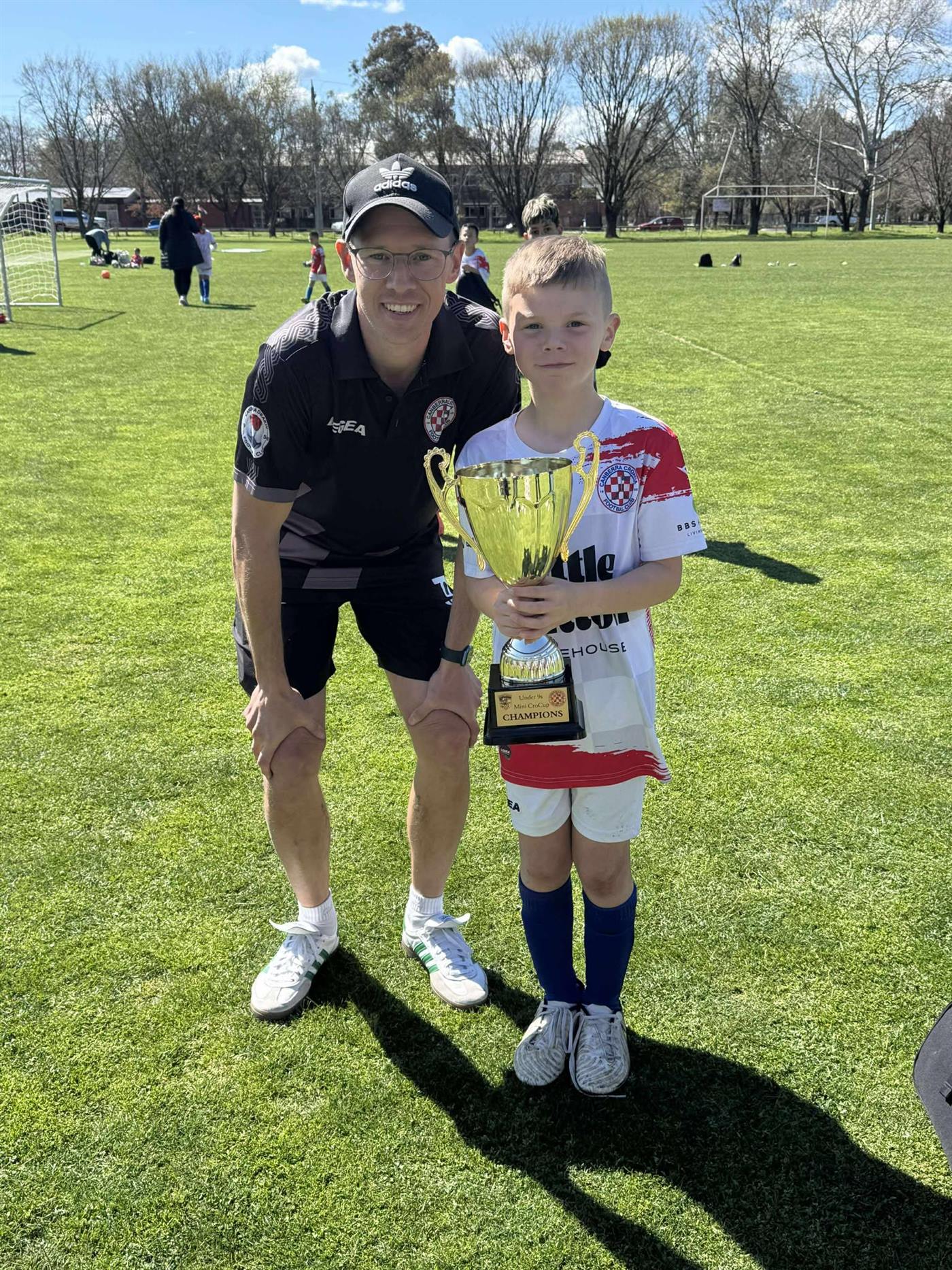 Young player with a championship trophy